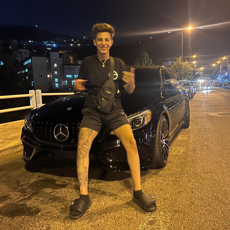 Moudi Dhainy with black Mercedes at night